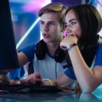 a man and a women strategizing their city building in Manor Lords to achieve best efficiency