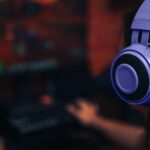 Girl in purple headphones Playing Endless Legend 2 on Her PC